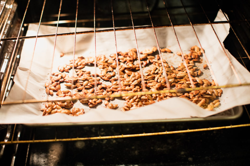 Roasted pumpkin seeds in the oven during the fall.