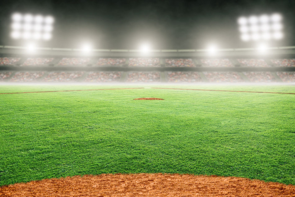 Professional baseball field lit up at night