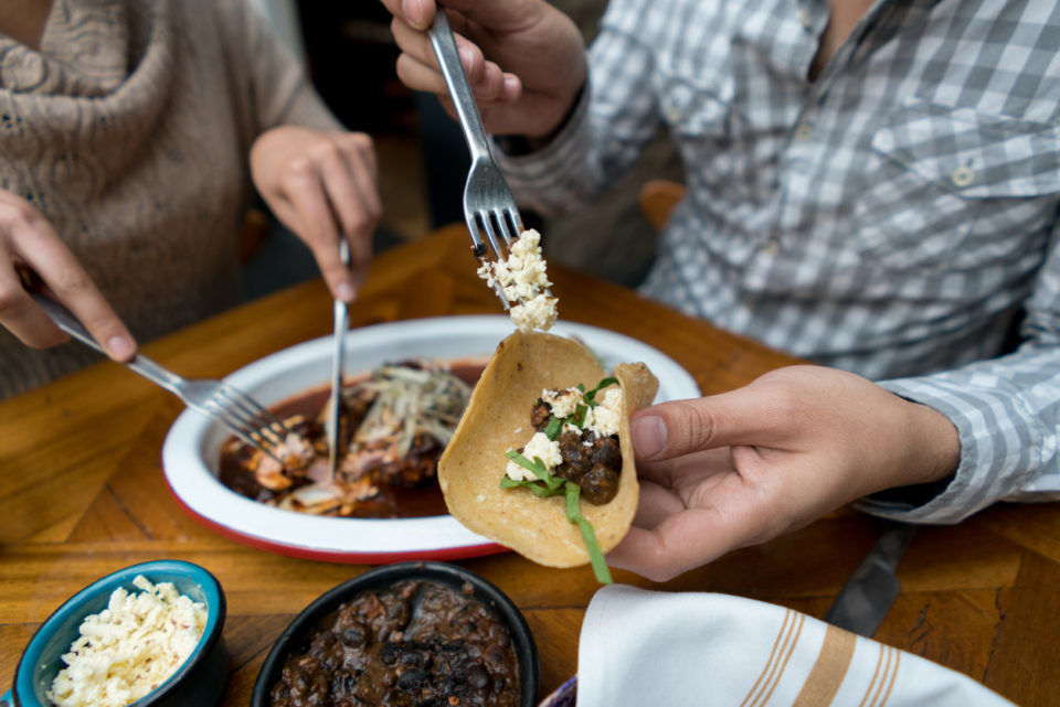 Friends eating at a Mexican restaurant