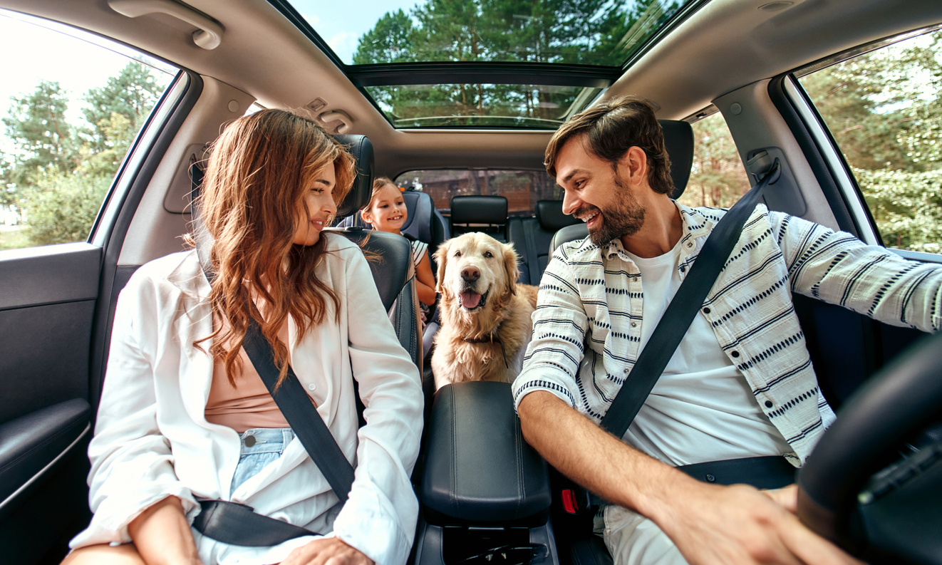 Family with dog in the car
