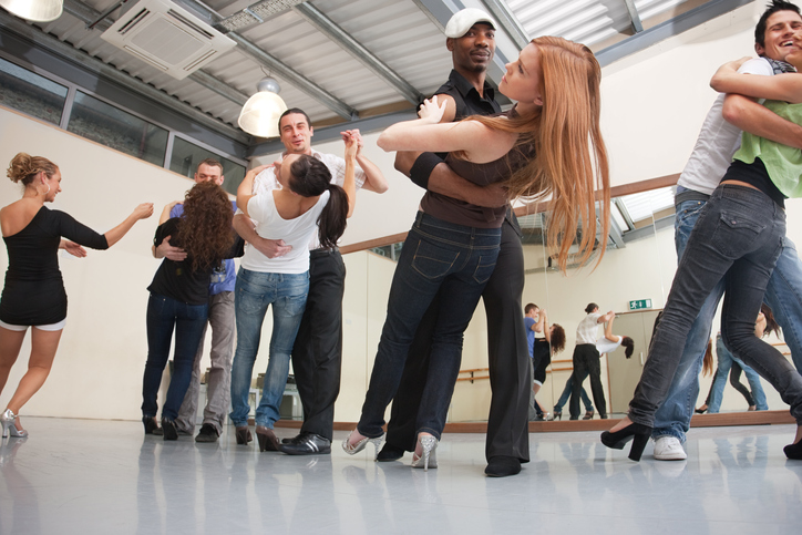 Salsa dance class in a studio.