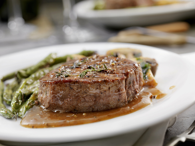 Medium Rare Fillet Mignon Steak with a Mushroom Sauce, Roasted Green Beans and Mushrooms