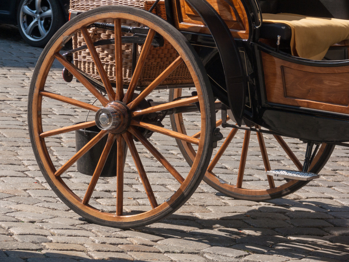 wheel of a horse carriage in the street