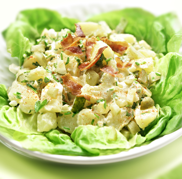 potato salad with letuce served in a white bowl