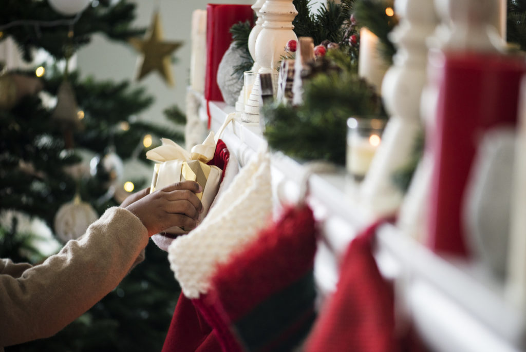 Christmas stockings are hanging by the chimney