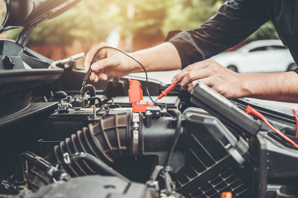 Auto mechanic working in garage