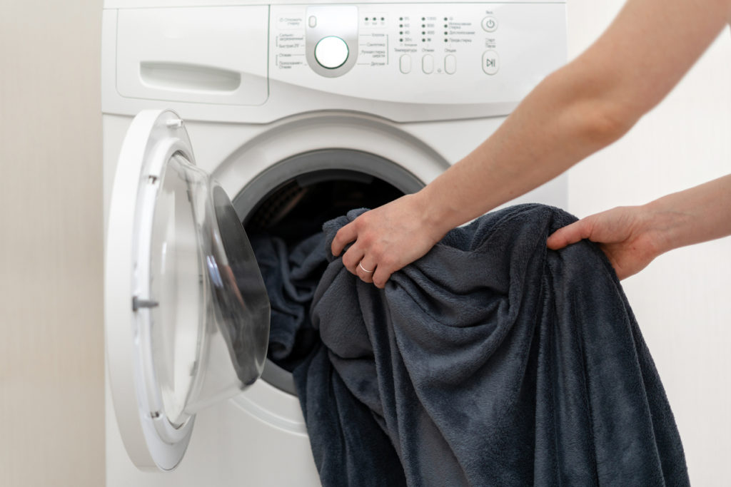 woman washing blanket