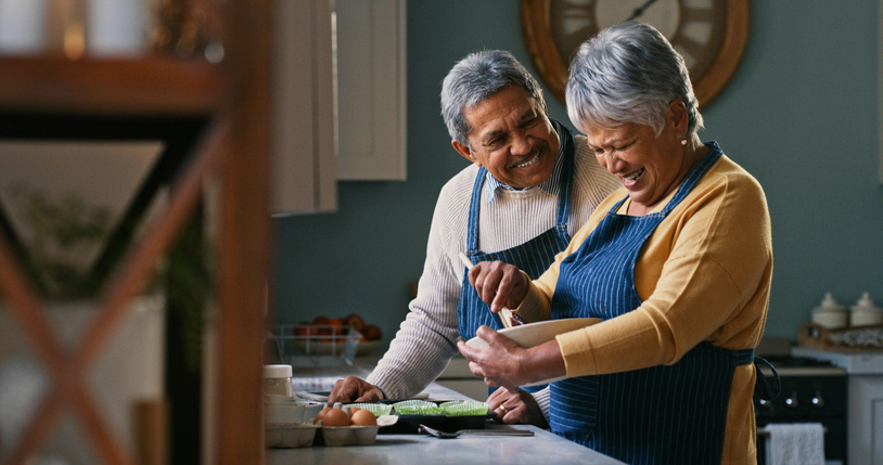 Shot of a happy senior couple baking at home